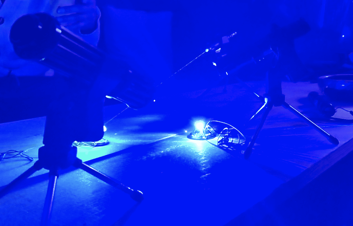 Blue laser light set up on tripods for a personal session