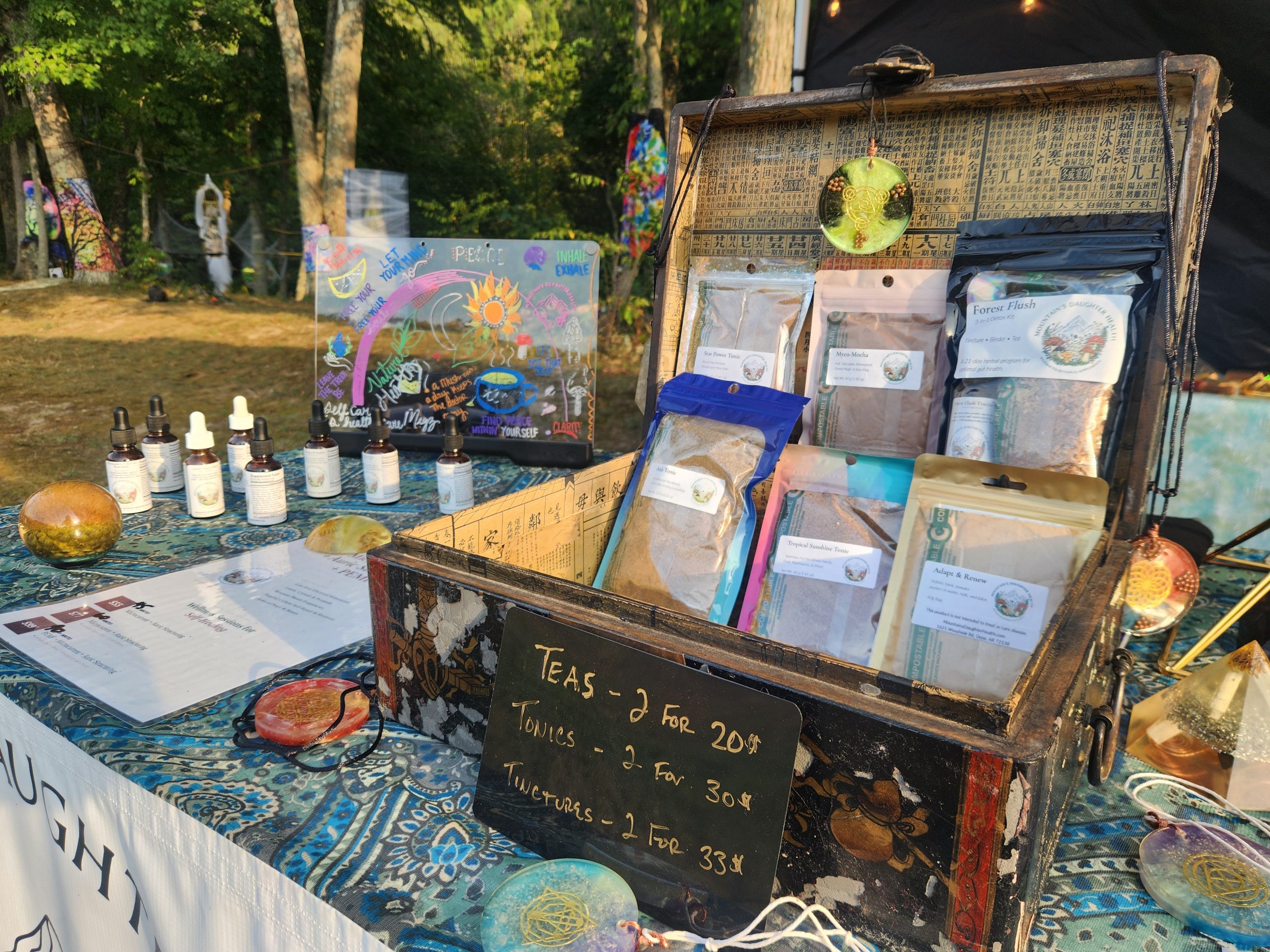 Mountain's Daughter Health teas and tinctures on a festival table